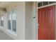 Inviting entryway features a bright red door and sidelight windows at 1400 Celebration Ave # 203, Celebration, FL 34747