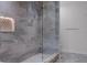 Beautiful bathroom featuring a glass enclosed shower with a marble tile surround at 1400 Celebration Ave # 203, Celebration, FL 34747