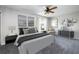 This staged bedroom features a plush bed, stylish décor, and plenty of natural light at 1635 Little Falls Cir, Orlando, FL 32807
