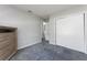An empty bedroom with plush carpet, a closet, and access to other areas at 1635 Little Falls Cir, Orlando, FL 32807