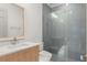 Bathroom featuring a tiled shower with sliding glass door, and a modern vanity at 1820 Glencoe Rd, Winter Park, FL 32789