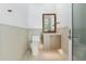 Modern bathroom features a sleek vanity with a decorative mirror and contemporary fixtures at 1820 Glencoe Rd, Winter Park, FL 32789