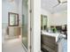 Modern bathroom featuring a vanity, toilet, and seamless transition to the outdoor living space at 1820 Glencoe Rd, Winter Park, FL 32789