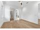Bedroom with hardwood floors, neutral paint, modern ceiling fan and ample windows at 1820 Glencoe Rd, Winter Park, FL 32789
