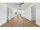 Bonus room with hardwood floors, neutral paint, modern ceiling fan and ample windows at 1820 Glencoe Rd, Winter Park, FL 32789