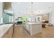 Gourmet kitchen with oversized island, designer finishes, and stainless steel appliances at 1820 Glencoe Rd, Winter Park, FL 32789