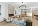 Elegant living room with herringbone fireplace, wet bar, and neutral furnishings at 1820 Glencoe Rd, Winter Park, FL 32789