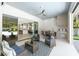 Cozy covered patio with a built-in grill and seamless transition to the interior kitchen, perfect for outdoor entertaining at 1820 Glencoe Rd, Winter Park, FL 32789