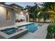 Backyard features a rectangular pool, in-ground spa, and view of an open concept indoor/outdoor living space at 1820 Glencoe Rd, Winter Park, FL 32789