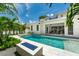 Stunning backyard with a luxurious swimming pool, jacuzzi, and outdoor seating area, ideal for relaxation and entertainment at 1820 Glencoe Rd, Winter Park, FL 32789