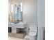 Stylish powder room featuring unique wallpaper, a vessel sink, and modern fixtures at 1820 Glencoe Rd, Winter Park, FL 32789