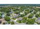 Serene aerial view of the property nestled in a lush, green neighborhood at 19554 Spring Oak Dr, Eustis, FL 32736