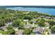 Stunning aerial view of property close to lake and surrounding lush greenery at 19554 Spring Oak Dr, Eustis, FL 32736