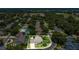 Beautiful aerial view of the property showcasing a landscaped yard and neighborhood at 19554 Spring Oak Dr, Eustis, FL 32736