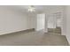 Bright and airy bedroom featuring ceiling fan, closet and carpeted floors, creating a comfortable and inviting space at 19554 Spring Oak Dr, Eustis, FL 32736