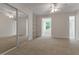 A bedroom with natural light from the window, a ceiling fan, and closet enhances the room's appeal at 19554 Spring Oak Dr, Eustis, FL 32736