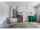 Well-lit garage featuring stainless steel refrigerator, water heater, and storage at 19554 Spring Oak Dr, Eustis, FL 32736