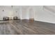 Spacious living room featuring beautiful wood floors, a staircase and large windows for natural light at 19554 Spring Oak Dr, Eustis, FL 32736