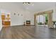 Spacious living room showcases a fireplace and sliding glass doors to the outside patio at 19554 Spring Oak Dr, Eustis, FL 32736