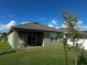 Enjoy a peaceful backyard with a cozy patio, perfect for outdoor dining and relaxation at 1982 King Ranch St, Kissimmee, FL 34744