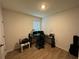 Functional bedroom with a window, desk, and laminate flooring at 1982 King Ranch St, Kissimmee, FL 34744