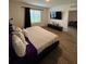 Spacious bedroom with a large window and a view, plus a television at 1982 King Ranch St, Kissimmee, FL 34744