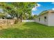 Wide backyard with a well-maintained lawn and privacy fencing at 2024 Flaming Arrow Ct, Fern Park, FL 32730
