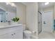 Bathroom featuring a white vanity, toilet, and a glass-enclosed shower at 2024 Flaming Arrow Ct, Fern Park, FL 32730