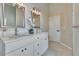 This bathroom features double sinks, modern cabinetry, and neutral colors, creating a luxurious and inviting space at 2024 Flaming Arrow Ct, Fern Park, FL 32730