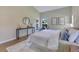 Bright and inviting bedroom, with a large comfortable bed, side table and ample natural light at 2024 Flaming Arrow Ct, Fern Park, FL 32730