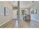 Bright dining room with hardwood floors, high ceilings, and ample natural light from large windows at 2024 Flaming Arrow Ct, Fern Park, FL 32730