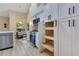 Well-appointed kitchen featuring stainless appliances, sleek cabinetry and a dining nook filled with natural light at 2024 Flaming Arrow Ct, Fern Park, FL 32730