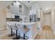 This kitchen boasts lots of counter space on the island, stainless steel appliances, and modern cabinetry at 2024 Flaming Arrow Ct, Fern Park, FL 32730