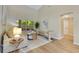 Well-lit living room with hardwood floors, comfortable furniture, and backyard view at 2024 Flaming Arrow Ct, Fern Park, FL 32730