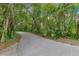 Walking path surrounded by lush greenery and trees, ideal for outdoor recreation at 2024 Flaming Arrow Ct, Fern Park, FL 32730