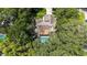 Aerial view showcasing the home's backyard pool and wooded lot at 205 Stevenage Dr, Longwood, FL 32779