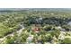 An aerial view shows this home surrounded by mature trees at 205 Stevenage Dr, Longwood, FL 32779