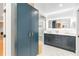 Bathroom with dual vanity, marble floor, and wardrobe for ample storage at 205 Stevenage Dr, Longwood, FL 32779