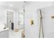 Stylish bathroom featuring marble floors, a glass shower, and modern gold shower fixtures at 205 Stevenage Dr, Longwood, FL 32779
