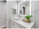 This bathroom features modern decor, white marble wall tile, and updated fixtures at 205 Stevenage Dr, Longwood, FL 32779