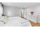 Bright bedroom featuring light-colored walls, wood flooring, and a modern dresser at 205 Stevenage Dr, Longwood, FL 32779