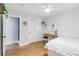 Bedroom featuring light wood floors, a ceiling fan, and a view to the backyard at 205 Stevenage Dr, Longwood, FL 32779