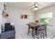 Cozy dining area with wooden table and chairs, a window, and modern décor at 205 Stevenage Dr, Longwood, FL 32779