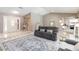 Spacious living area with tile flooring and a comfortable sofa, flowing into the entryway and showcasing the open layout at 205 Stevenage Dr, Longwood, FL 32779