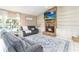 Inviting living area with a stone fireplace, built-in shelving, and access to an outdoor pool view through sliding glass doors at 205 Stevenage Dr, Longwood, FL 32779