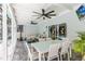 Open-concept screened-in patio with dining and lounge areas, perfect for entertaining guests at 205 Stevenage Dr, Longwood, FL 32779
