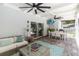 Spacious screened-in patio featuring a dining table, outdoor seating, and a wall-mounted television at 205 Stevenage Dr, Longwood, FL 32779
