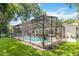 A private screened-in pool area, perfect for outdoor entertaining and relaxation, set in a well-maintained backyard at 205 Stevenage Dr, Longwood, FL 32779