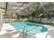 Sparkling in-ground pool with screened enclosure and meticulously maintained landscaping at 205 Stevenage Dr, Longwood, FL 32779