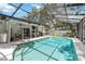 Beautiful backyard oasis featuring a sparkling pool, screened enclosure, and outdoor entertaining space at 205 Stevenage Dr, Longwood, FL 32779